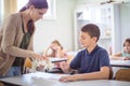 Teenage students with teacher on biology class. Close up Royalty Free Stock Photo