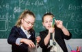 Biology lesson. Back to school. Little scientist work with microscope. when little thing mean lot. Children using Royalty Free Stock Photo