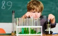 Biology science. school kid scientist studying science. Little boy is making science experiments. science experiments in Royalty Free Stock Photo