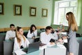 Biology teacher gives a lesson to pupils in classroom. Schoolchildren at biology lesson at school with DNA model on the Royalty Free Stock Photo