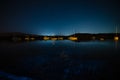 Bioluminescence glow in the bay nightscape with boats