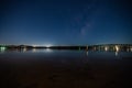 Bioluminescence glow in the bay nightscape with boats