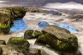 Bioluminescent tide glows on some rocks in La Jolla, California