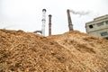 Biomass energy factory and tractor Royalty Free Stock Photo