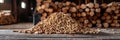 Biomass wood pellets and woodpile stack with copy space, blurred background for text placement.