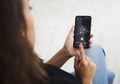 Unrecognizable Lady Unlocking Phone Scanning Fingerprint Sitting Indoors, Cropped