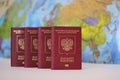 Biometric russian passports are in a row on the background of the world map. . The passport of the Russian Federation Royalty Free Stock Photo