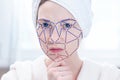 Biometric verification of a modern young woman. New technology of face recognition on polygonal grid Royalty Free Stock Photo