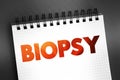 Biopsy - extraction of sample cells for examination to determine the presence or extent of a disease, text concept on notepad