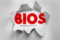 BIOS Basic Input Output System text revealed through torn paper surface, computing technology concept representing firmware Royalty Free Stock Photo