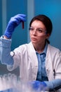 Biotechnologist woman scientist researching with a blood tube in pharma lab Royalty Free Stock Photo