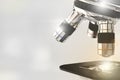 cell analyzing concept, laboratory hi-tech scientific microscope with flare on bokeh background - object 3D illustration Royalty Free Stock Photo