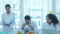 Biotechnology researcher scientist working look microscope in the medical development laboratory for vaccine development. Royalty Free Stock Photo