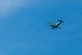 Biplane flying in blue sky Royalty Free Stock Photo