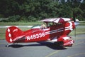 Biplane takes off at an airport Royalty Free Stock Photo