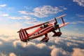 a biplane with red and white stripes in the sky Royalty Free Stock Photo