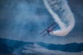 Biplane with Smoke Royalty Free Stock Photo
