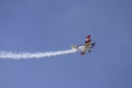 Biplane with trailing smoke Royalty Free Stock Photo