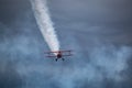 Biplane with White Smoke Royalty Free Stock Photo