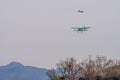 Biplanes flying over mountainous region Royalty Free Stock Photo