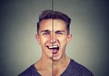 Bipolar disorder concept. Young man with double face expression Royalty Free Stock Photo