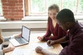 Biracial couple signing contract at meeting, buying new house, m Royalty Free Stock Photo