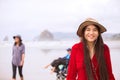 Biracial teen girl in red dress and hat  at beach Royalty Free Stock Photo