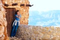 Biracial teen girl relaxing, leaning against rock wall overlooki Royalty Free Stock Photo