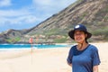 Biracial teen girl standing on beach in Hawaii, smiling Royalty Free Stock Photo