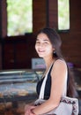 Biracial teen girl waiting in line at cafe counter Royalty Free Stock Photo