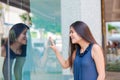 Biracial teen girl window shopping in urban setting downtown Royalty Free Stock Photo