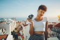 Biracial young girl with retro photo camera in Lisbon Royalty Free Stock Photo