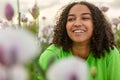 Biracial Young Woman Girl Teenager in Field of Flowers at Sunset Royalty Free Stock Photo