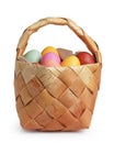 Birch bark basket full of pastel colors easter eggs Royalty Free Stock Photo