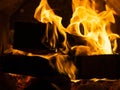 Birch firewood burns in a metal stove Royalty Free Stock Photo