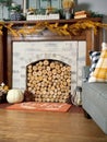 Birch logs stacked in brick fireplace - cozy home interior