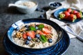 Bircher muesli with strawberries, blueberries, chia seeds, walnuts, sunflower seeds and pumpkin seeds Royalty Free Stock Photo