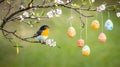 Easter Eggs Hanging from Blossoming Tree Branch with Bird Royalty Free Stock Photo