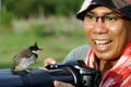 Bird on camera photographer