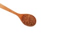 Bird cherry flour in brown wooden spoon on white background, close-up. Design element. Shredded berry Bird cherry use in baking