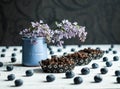 Bird Cherry Flour Cakes with blueberries and lilac flowers.