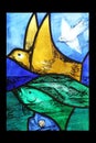 Bird, detail of Saint Francis of Assisi stained glass window in Benediktbeuern Abbey, Germany Royalty Free Stock Photo