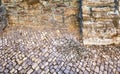 Bird droppings on old paving stones on a natural stone wall Royalty Free Stock Photo