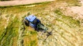 Bird eye of Hay rake tractor turning the hay Royalty Free Stock Photo