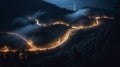 A bird eye scenery view of a winding road cutting turns through clouds of serpentine a dense forest , mountain landscape.Top Down Royalty Free Stock Photo