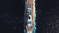 Bird eye top view of large cruiser ship in deep blue water in a sunny day, luxury concept. Stock. Aerial view of luxury