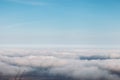 Bird eye view at clouds in blue sky top view from drone from airplane window