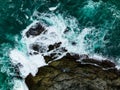 Bird eye view seashore with big wave crashing on rock cliff. Beautiful waves sea surface in sunny day summer background, Amazing Royalty Free Stock Photo