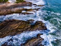 Bird eye view seashore with big wave crashing on rock cliff. Beautiful waves sea surface in sunny day summer background, Amazing Royalty Free Stock Photo