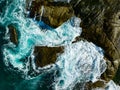 Bird eye view seashore with big wave crashing on rock cliff. Beautiful waves sea surface in sunny day summer background, Amazing Royalty Free Stock Photo